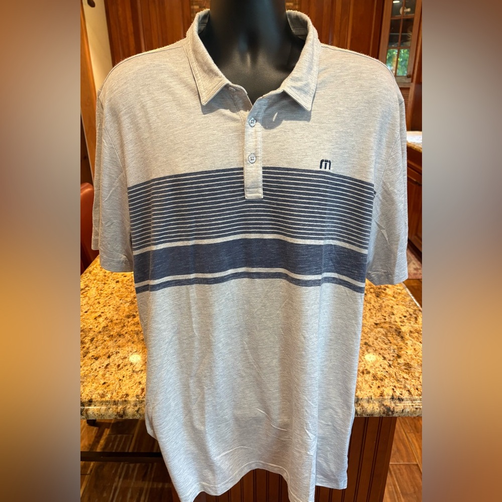 Travis Mathew men’s golf polo. Sharp‎ grey with blue print & logos front/back.